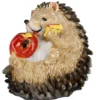 Igel mit einem Apfel, sitzend